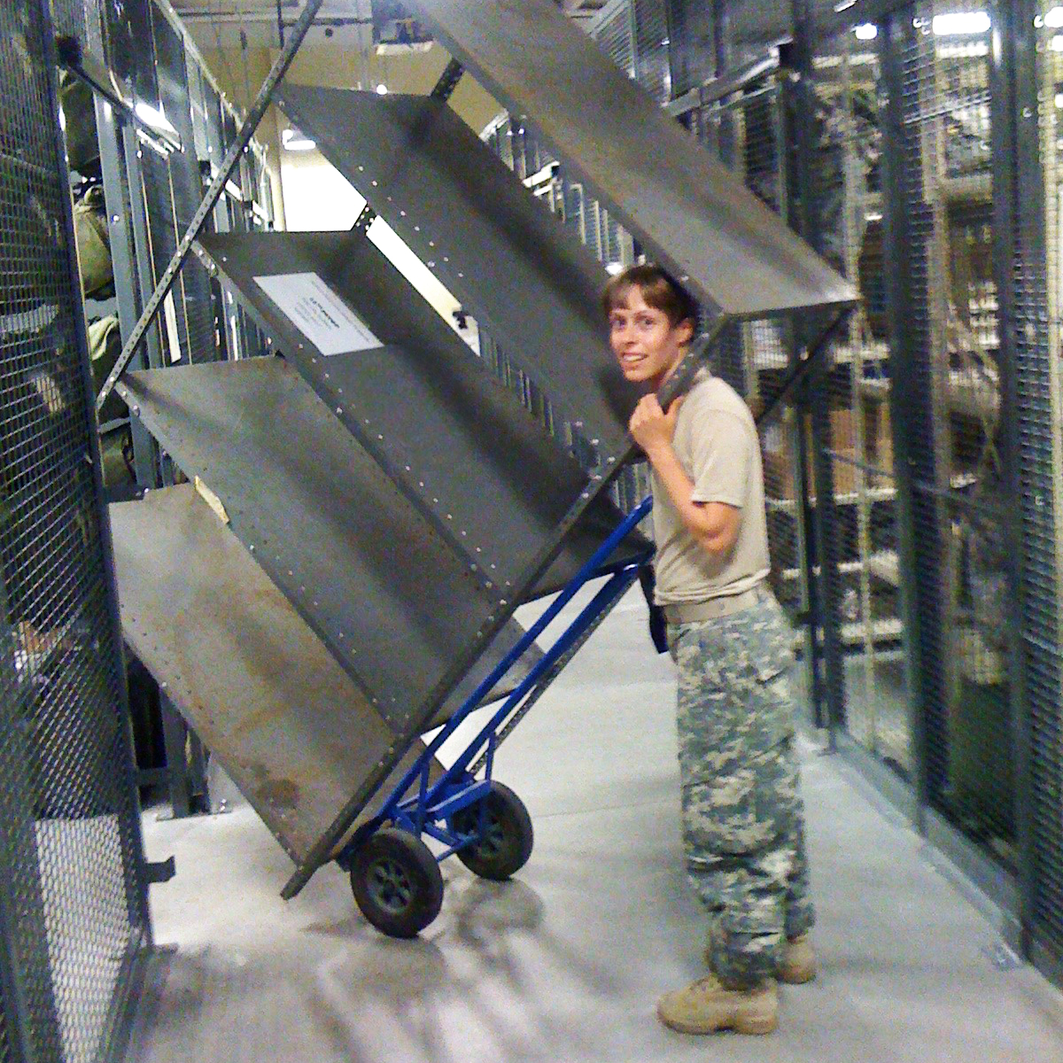 Christine carting shelving unit in Army in 2011